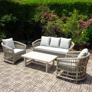 Outdoor wicker set of two arm chairs and a three seater chair.