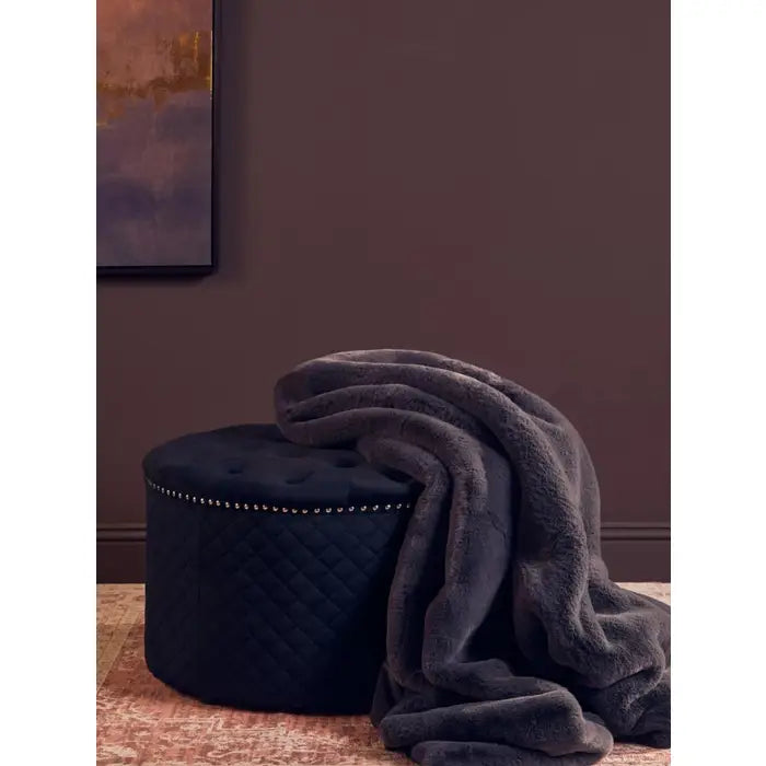 Luxurious Belsey Luna faux fur throw in grey.