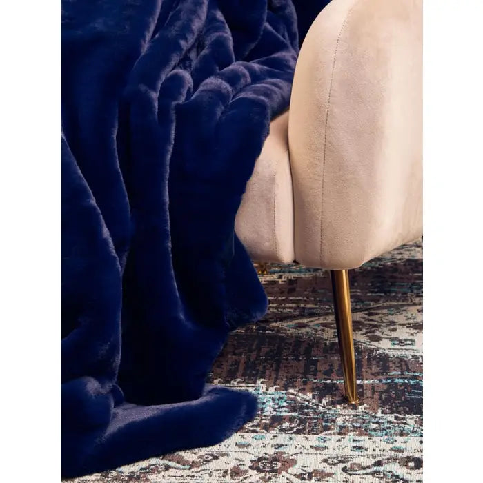 Soft touch fur throw in navy blue.