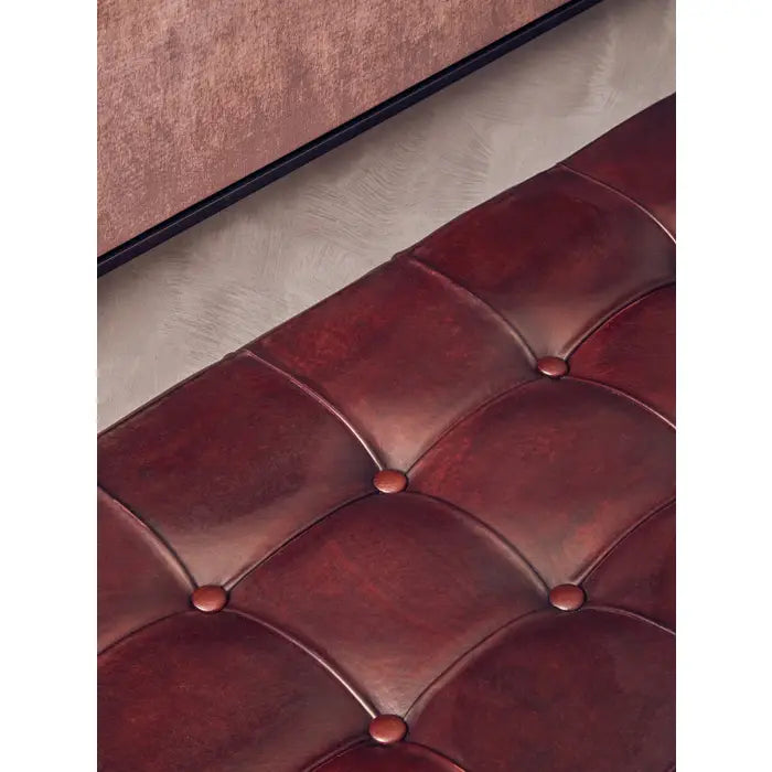Antique brown leather, this bench has a soft button tufted seat.
