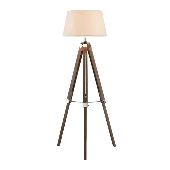 Plan background showing a tall floor lamp with dark wood tripod legs, cream shade and silver metal hinges.