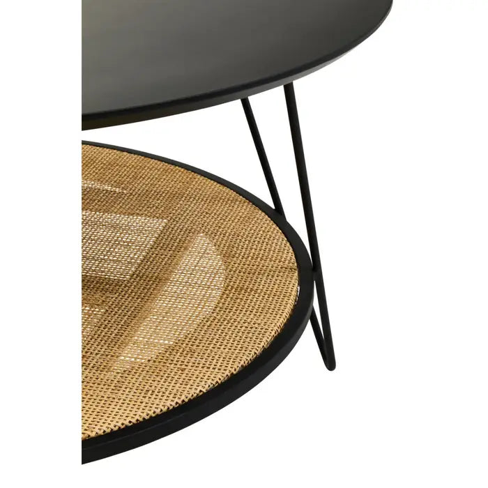 Coffee table with natural rattan shelf with black metal top and matching black metal legs.
