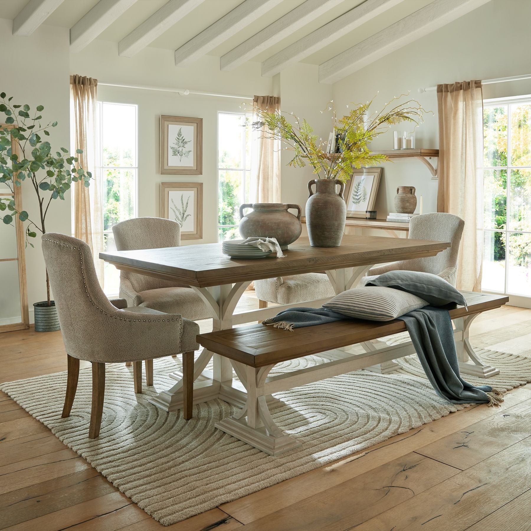 Rectangular Dining Table flaunts an off white painted bottom combined with a stained wooden top.
