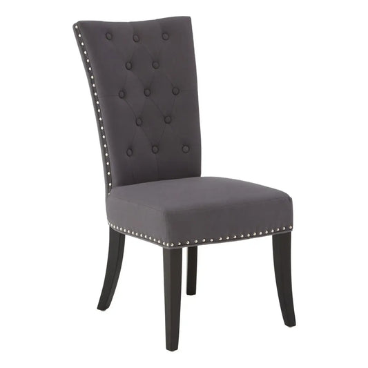 Bringing a regal touch to the dining area, this elegantly designed modern dining chair will offer style and comfort.

The solid wooden frame is upholstered in hard-wearing grey lining, featuring a decorative stud detail around the edges culminating in a look of grandeur. The high backrest and seat are padded ensuring total support and comfort when seated.

Dimensions; H99 x L65 x W49