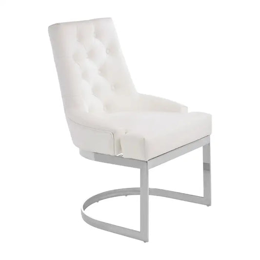 Allure dining chair upholstered with soft faux leather and has a fresh white finish. Back button tufting adds texture to the look. The stainless steel legs have a reflective silver finish and arc at the base to complement the chair's design lines.  Plain white background.