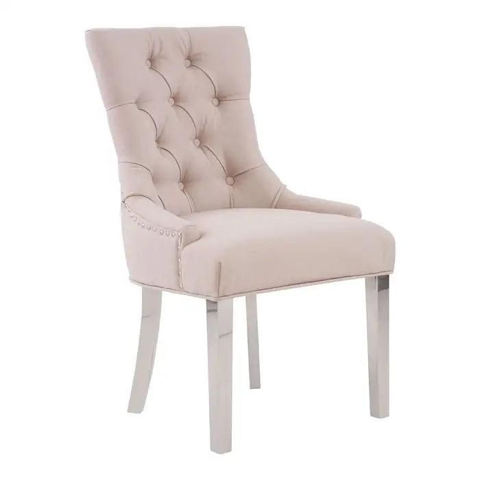 Featuring sophisticated elegance, the natural Raife dining chair will make a statement in a modern, but classically styled, dining room.

Minimal yet stylish, this dining chair has sledge legs at the back and straight legs at the front. The button-backed natural coloured upholstery is tufted in a diamond pattern, giving a classic flair to the aesthetic.

Dimensions; H76 x L58 x W64

Minimum order of 2