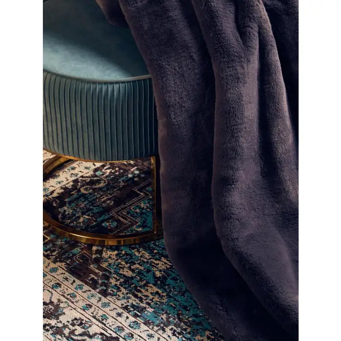 Luxurious Belsey Luna faux fur throw in grey.