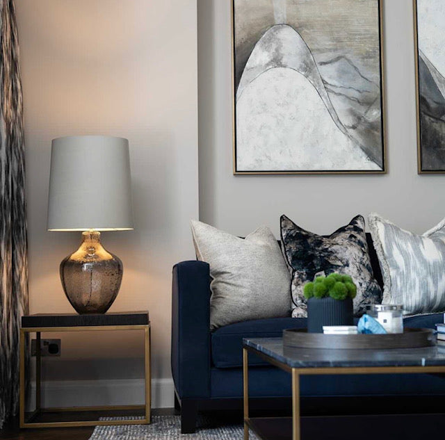 The Brazon Side Table features crisp lines of brass with a gorgeous visible wood grain which brings warmth and luxury to any space.
