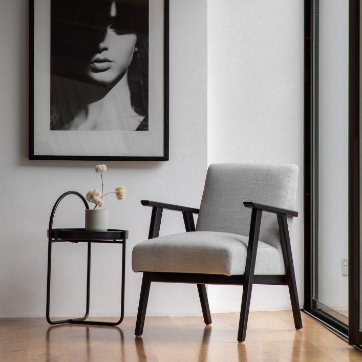 Linen armchair with wooden frame.