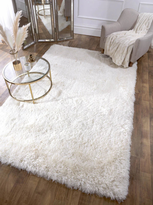 Experience the softness of luxurious premium shaggy pile. Its plush ivory fabric will bring style and comfort to any room, inviting you to sink your feet into its thick, sumptuous pile. Enjoy quality and comfort today!