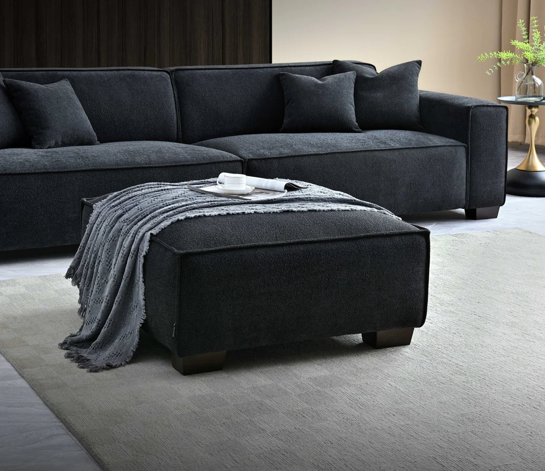 Footstall showed centre of picture on soft rug with 2 seater sofa in background complete with a gold side table. 