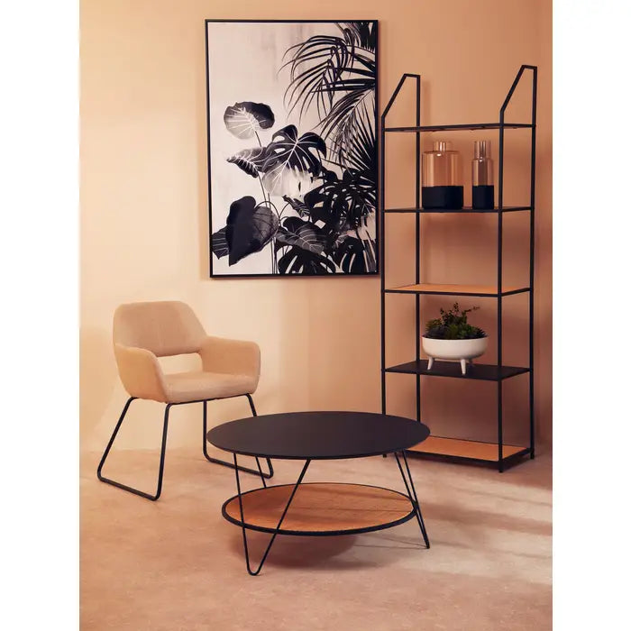 Coffee table with natural rattan shelf with black metal top and matching black metal legs.