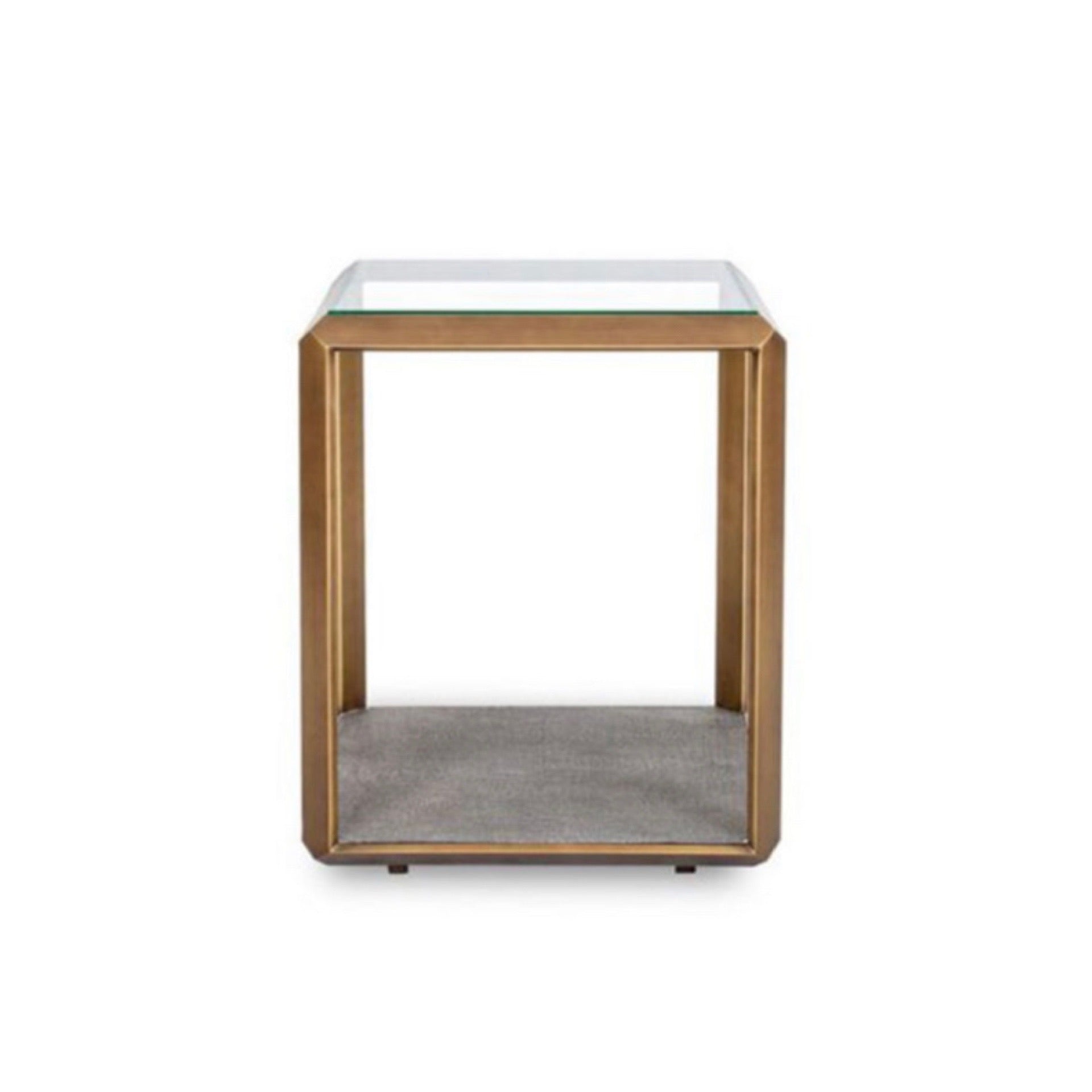 The Earl Side Table in Ivory or Grey combines glass, brass, and shagreen to create a harmonious juxtaposition of materials, blending modern aesthetics with a hint of exotic flair.