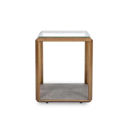 The Earl Side Table in Ivory or Grey combines glass, brass, and shagreen to create a harmonious juxtaposition of materials, blending modern aesthetics with a hint of exotic flair.