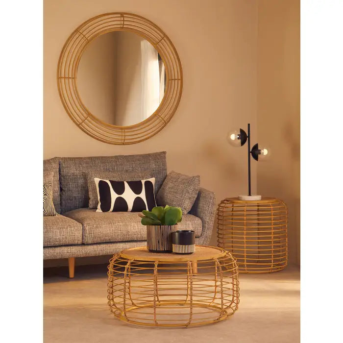 Woven rattan coffee table with a contrasting gold frame.