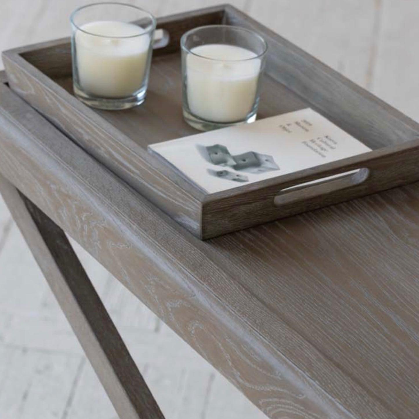Console table with grey aged oak with visible grain. 